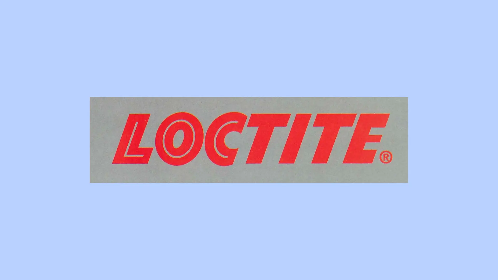 El logotipo rojo de Loctite sobre un fondo gris.